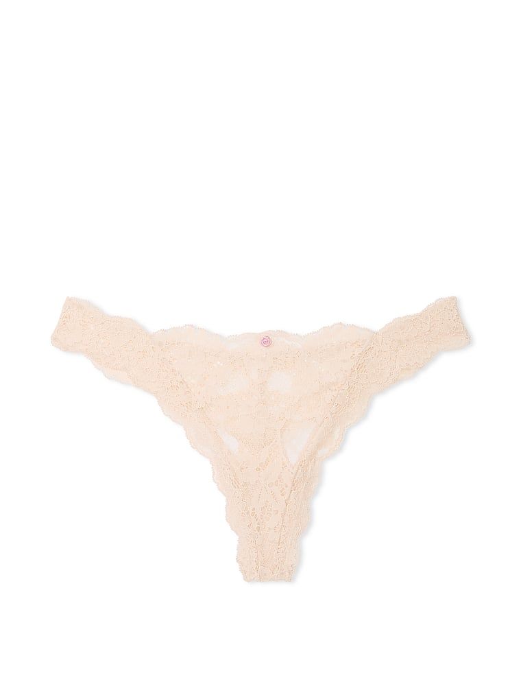 Tanga din dantelă din dantelă. Produsul este bej și provine din colecția Dream Angels.