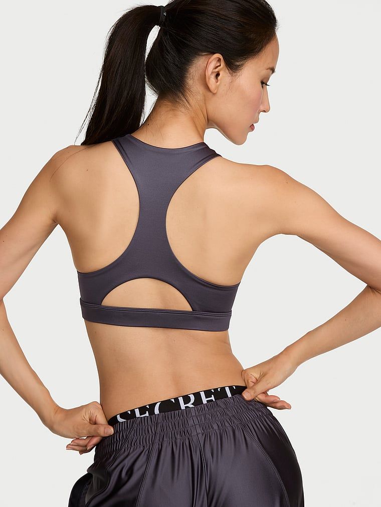 Sutiene sport realizat din material lucios VSX GlossyTech. Produsul este de culoare gri și provine din colecția VSX.