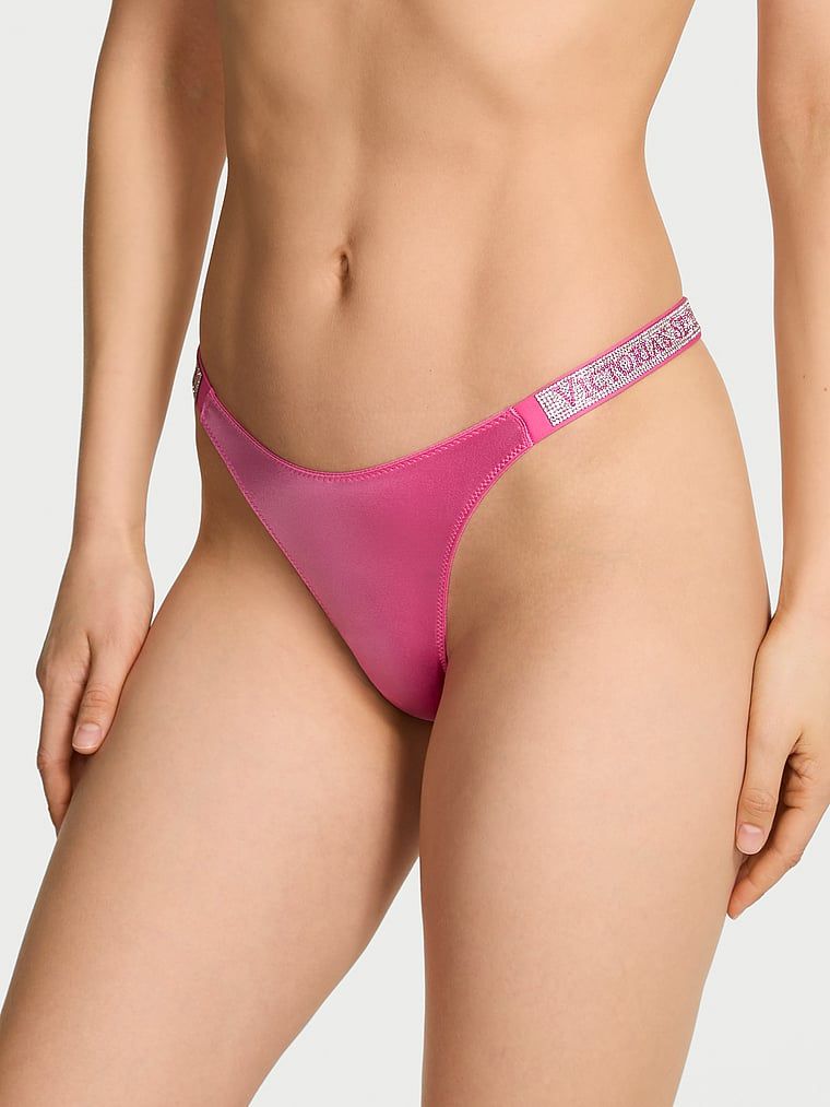 Tanga cu curele lucioase Shine Strap. Produsul este roz și provine din colecția Very Sexy.