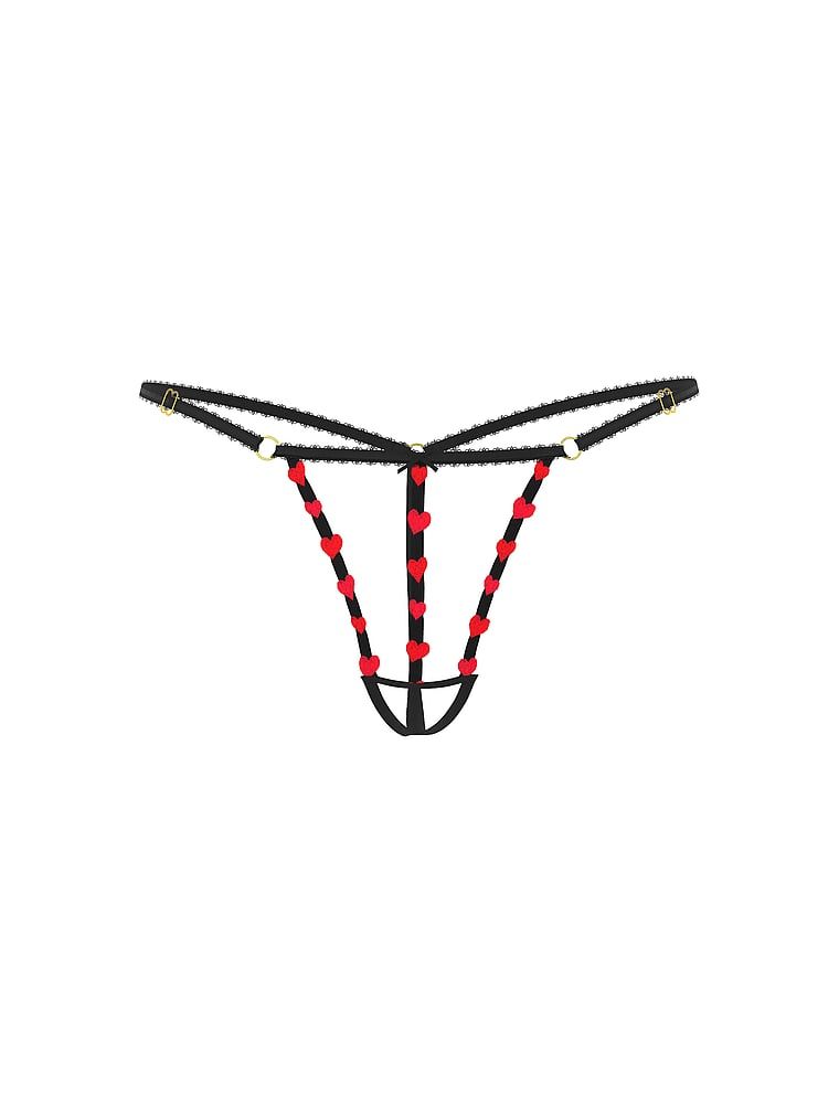 Tanga fără pas Tease Strappy Heart. Produsul este modelat și provine din colecția Very Sexy.