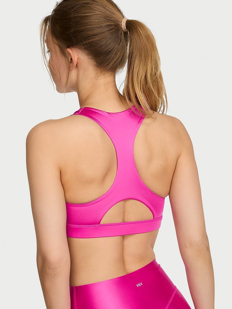 Sutiene sport realizat din material lucios VSX GlossyTech. Produsul este roz și provine din colecția VSX.