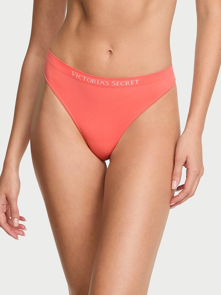 Tanga fără cusură. Produsul este portocaliu și provine din colecția Seamless (Seamless Collection).