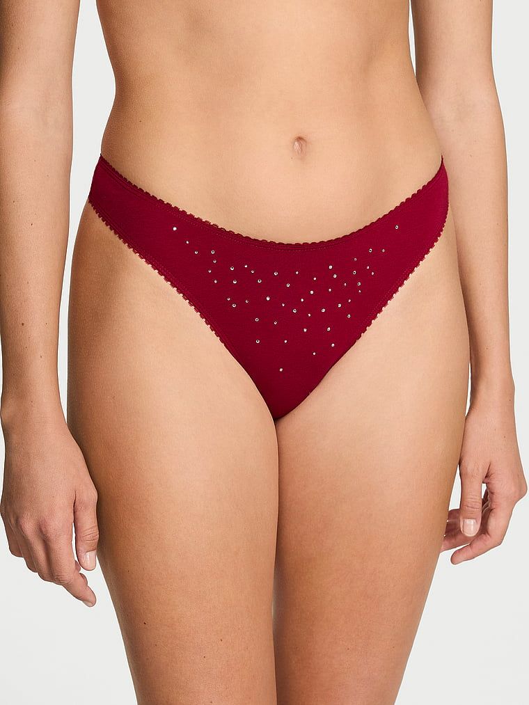 Tanga din bumbac cu paiete Sparkle. Produsul este de culoare roșie și provine din colecția Victoria's Secret.