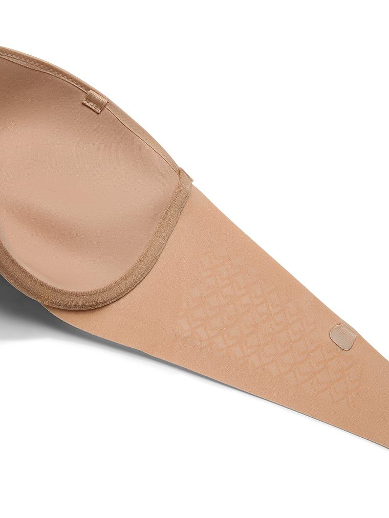 Suten fără bretele cu bretele ușor căptușite. Produsul este de culoare bej și provine din colecția Invisible by Victoria's Secret.