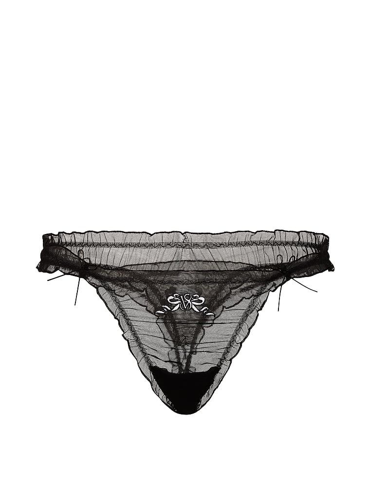Tanga cu volane, fundițe din plasă cu volane. Produsul este negru și provine din colecția Dream Angels.
