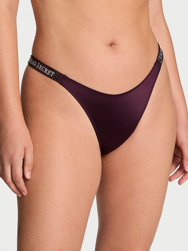 Chiloți brazilieni cu dungi braziliene Shine Strap. Produsul este de culoare mov și provine din colecția Very Sexy.