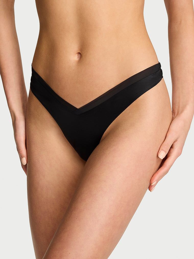 Tanga cu curele pe spatele Sheer Reveal. Produsul este negru și provine din colecția Very Sexy.