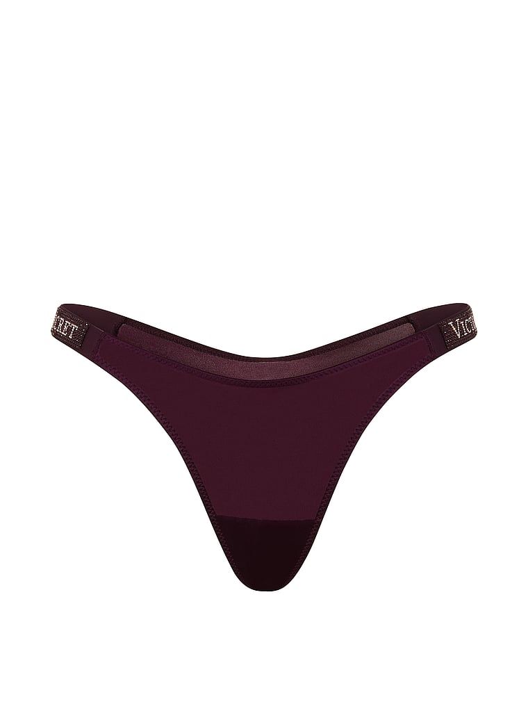 Tanga cu curele lucioase Shine Strap. Produsul este de culoare mov și provine din colecția Very Sexy.