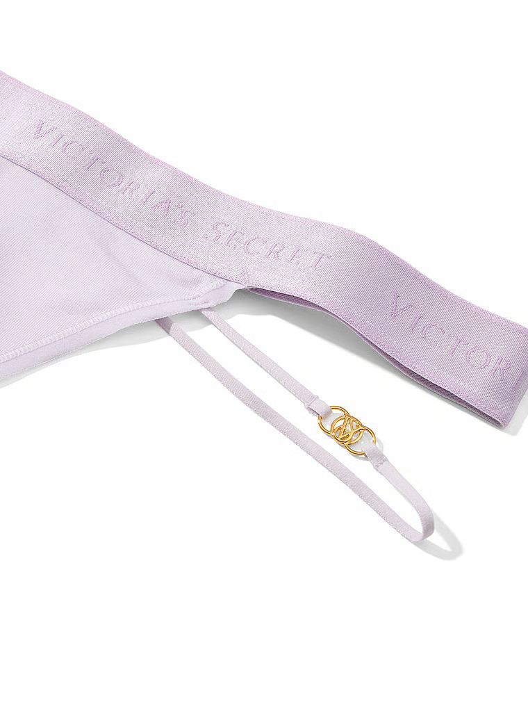 Tanga de bumbac cu logo și bretele: Strappy. Produsul este de culoare mov și provine din colecția Bumbac.