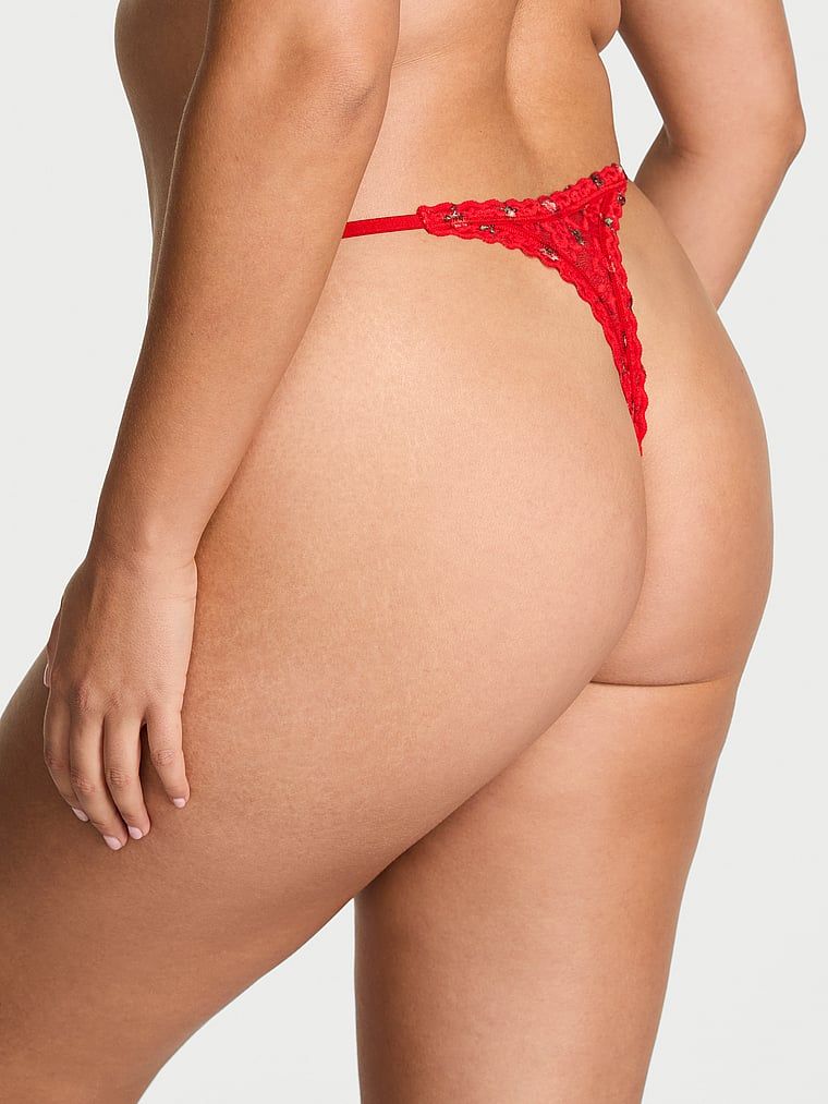 Tanga din dantelă. Produsul este de culoare florală și provine din colecția Lacie.