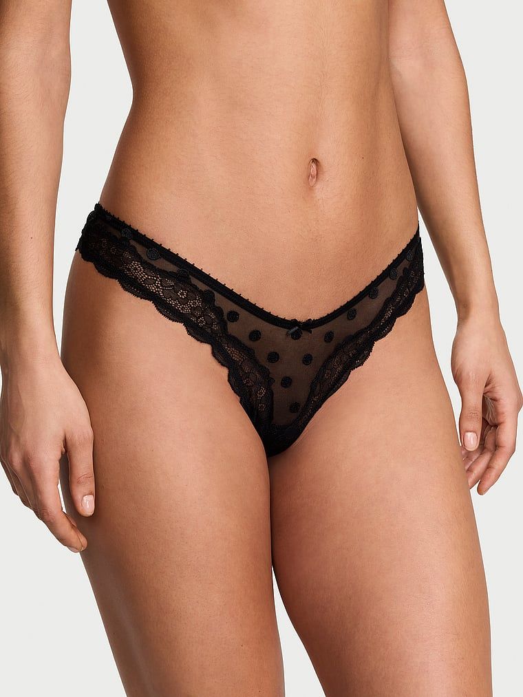 Tanga Tease Sheer Dot din plasă înaltă cu picioare înalte. Produsul este modelat și provine din colecția Victoria's Secret.
