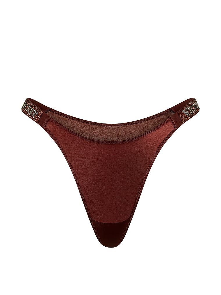Chiloți brazilieni din dantelă cu dungi braziliene Shine Strap. Produsul este modelat și provine din colecția Very Sexy.