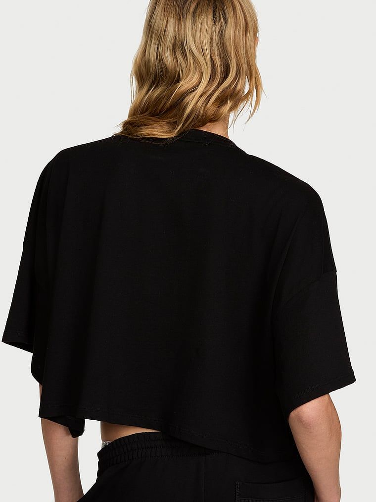 Tricou scurt din bumbac, supradimensionat, cu logo-ul brandului. Produsul este negru și provine din colecția Angel Essentials.