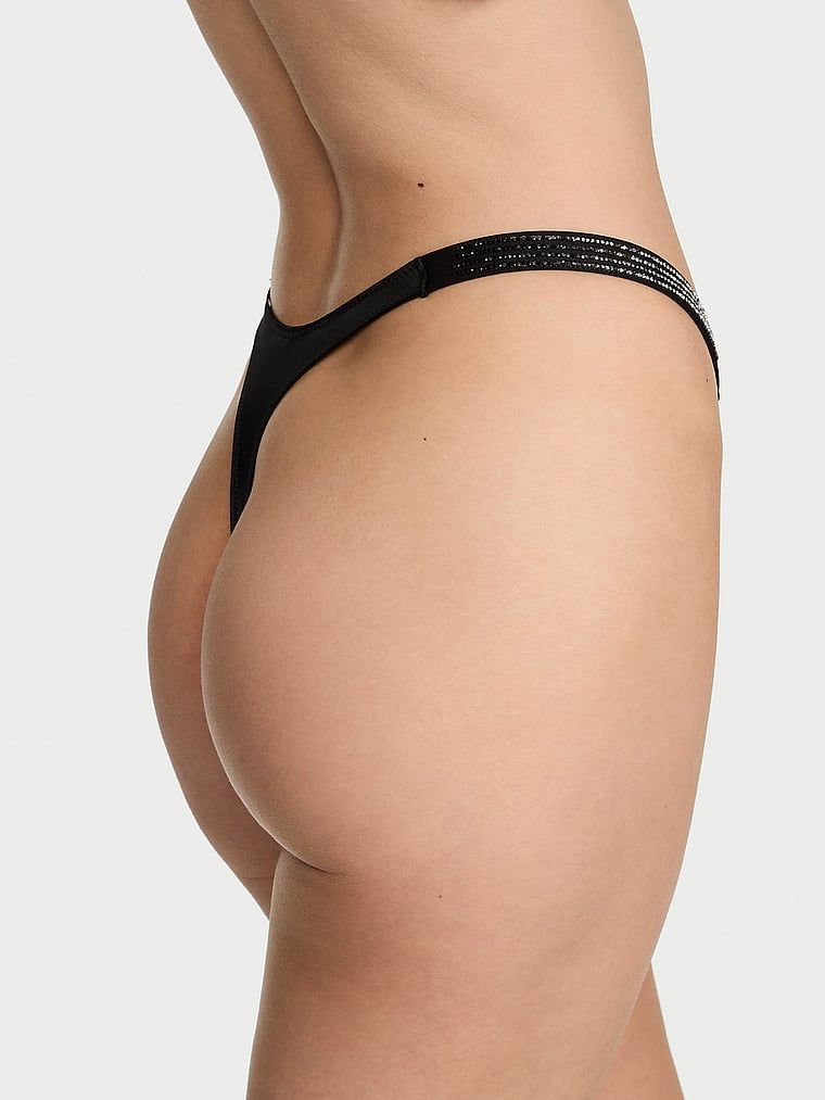 Tanga cu bretele Shiny Stripe Shine. Produsul este negru și provine din colecția Very Sexy.