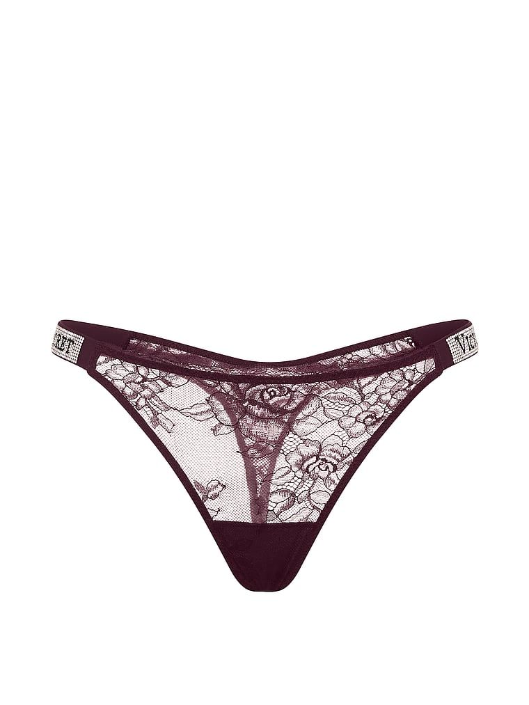 Tanga din dantelă cu bretele lucioase Shine Strap. Produsul este de culoare mov și provine din colecția Very Sexy.
