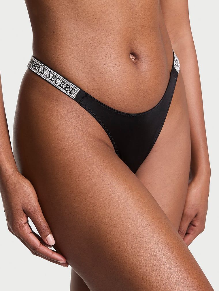 Tanga cu curele strălucitoare Shine Trap. Produsul este negru și provine din colecția Very Sexy.