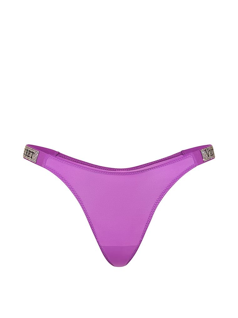 Tanga cu curele lucioase Shine Strap. Produsul este de culoare mov și provine din colecția Very Sexy.