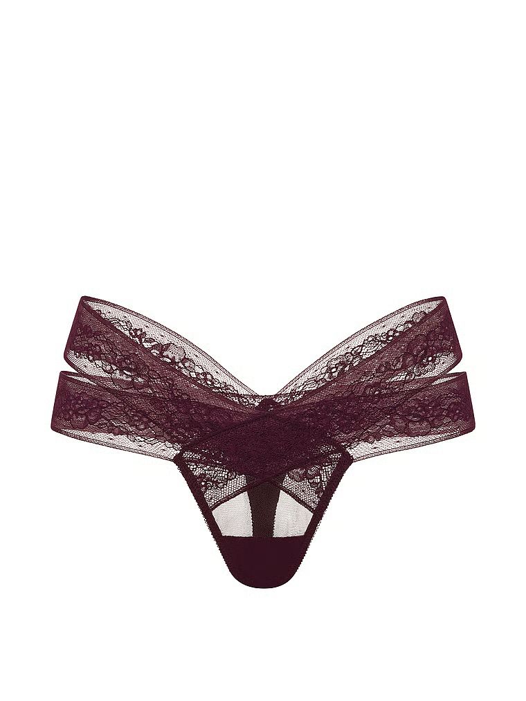 Tanga cu decupaje și dantelă cu bretele. Produsul este de culoare mov și provine din colecția Very Sexy.