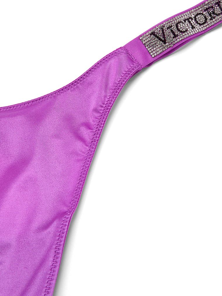 Tanga cu curele lucioase Shine Strap. Produsul este de culoare mov și provine din colecția Very Sexy.