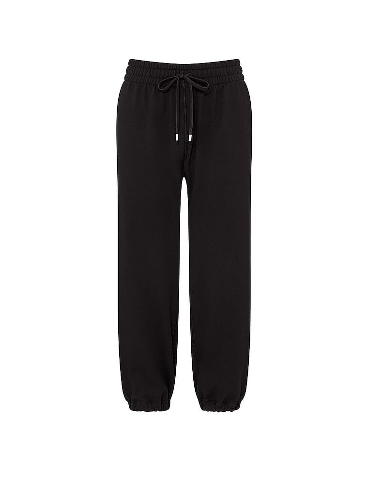 Pantaloni de trening de pescari din bumbac în timpul liber. Produsul este negru și provine din colecția Angel Essentials.