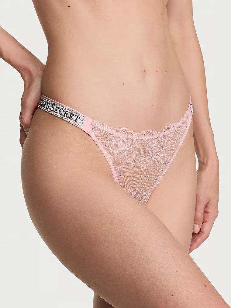 Tanga din dantelă cu curele strălucitoare Shine Strap Produsul este de culoare roz și provine din colecția Very Sexy.