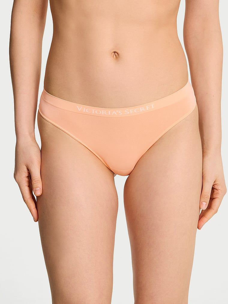 Tanga fără cusură. Produsul este portocaliu și provine din colecția Seamless (Seamless Collection).