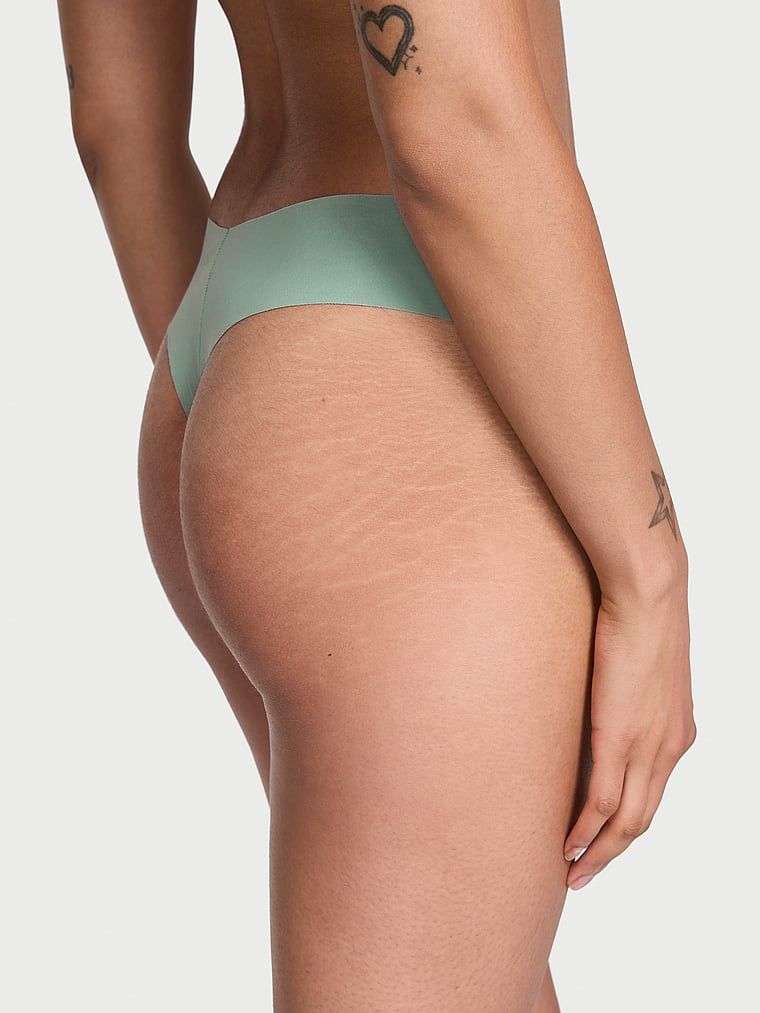 Tanga fără sudură fără prezentare. Produsul este de culoare verde și provine din colecția No-Show.