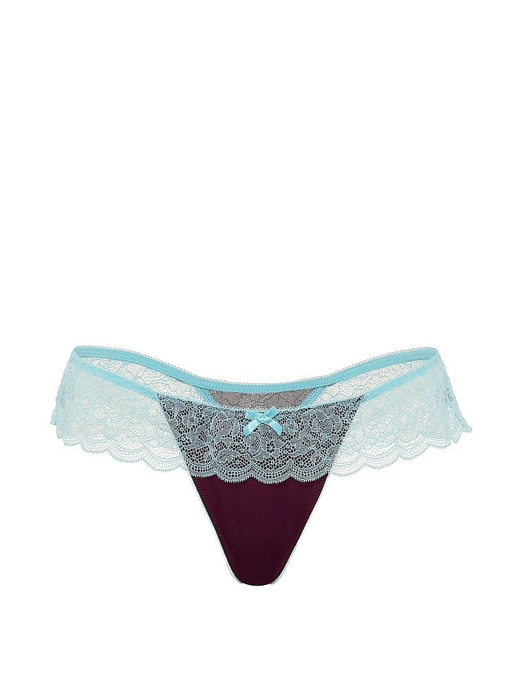 Tanga de satin cu volane și tachină. Produsul este de culoare mov și provine din colecția Victoria's Secret.