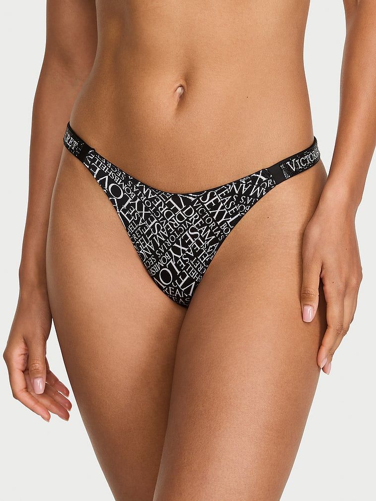 Tanga cu curele lucioase Shine Strap. Produsul are o culoare cu model și provine din colecția Very Sexy.