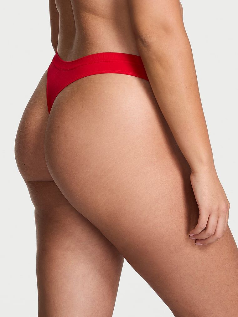 Tanga cu arc fără sudură. Produsul este de culoare roșie și provine din colecția Seamless