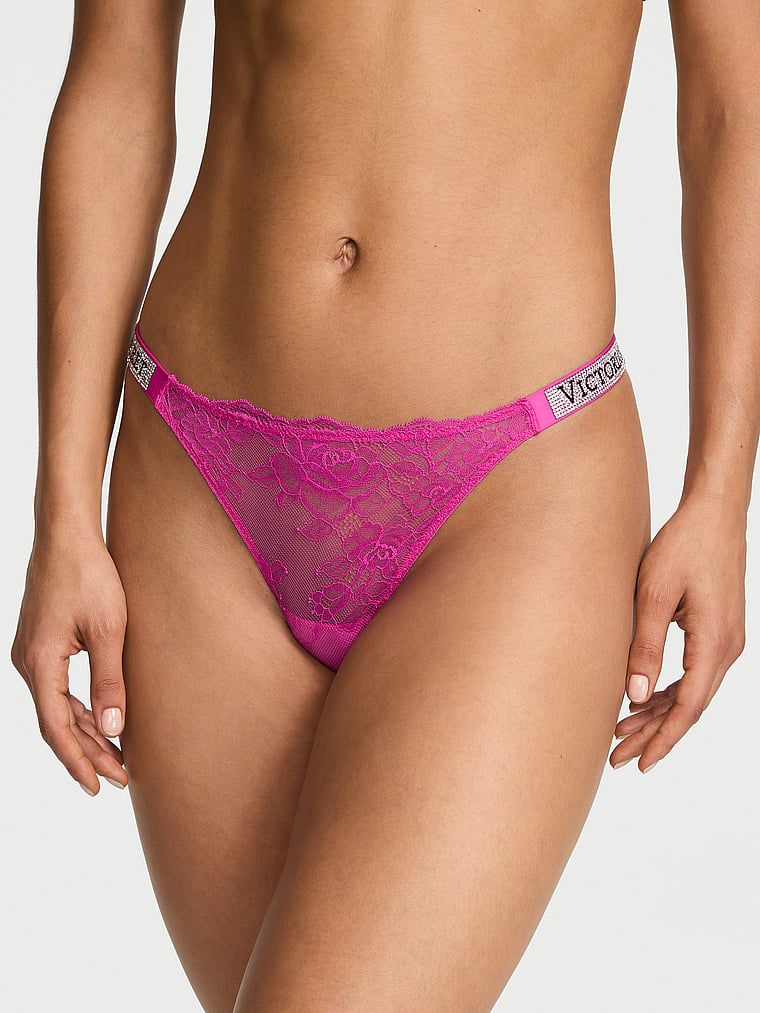 Tanga din dantelă cu bretele lucioase Shine Strap. Produsul este roz și provine din colecția Very Sexy.