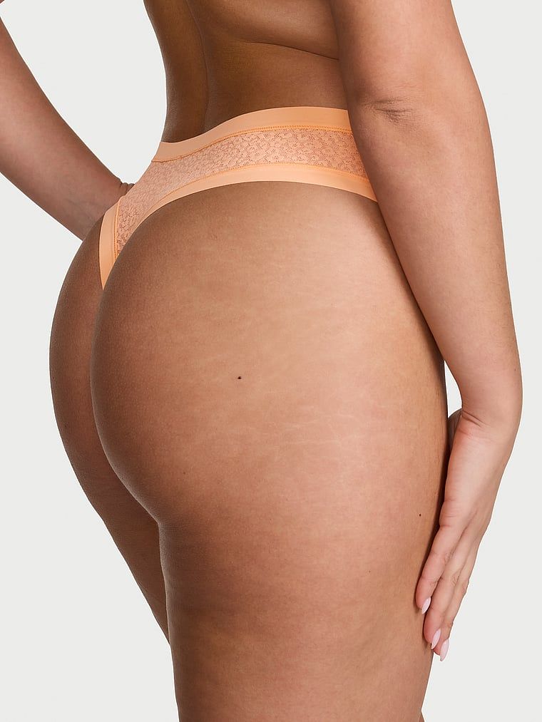 Tanga cu Leopard cu imprimeu de leopard, care nu apare. Produsul este portocaliu și provine din colecția No-Show.