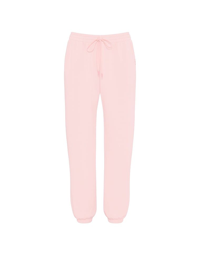 Pantaloni de trening din bumbac în afara serviciului. Produsul este roz și provine din colecția Angel Essentials.