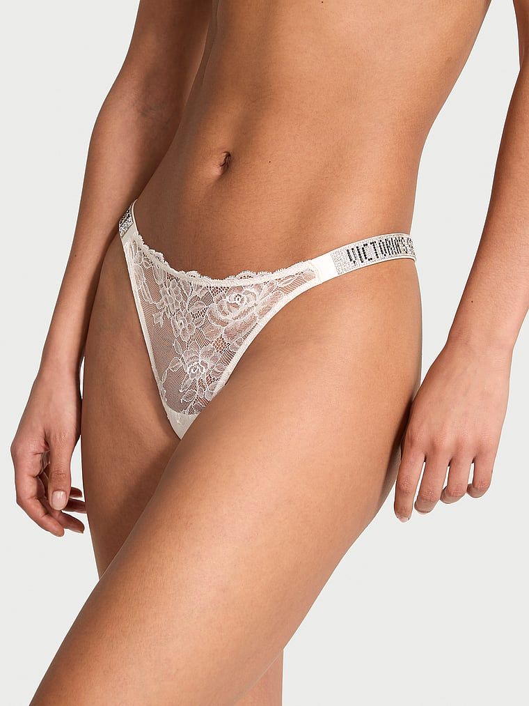 Tanga Shine Strap Rose Lace. Produsul este alb și provine din colecția Very Sexy.
