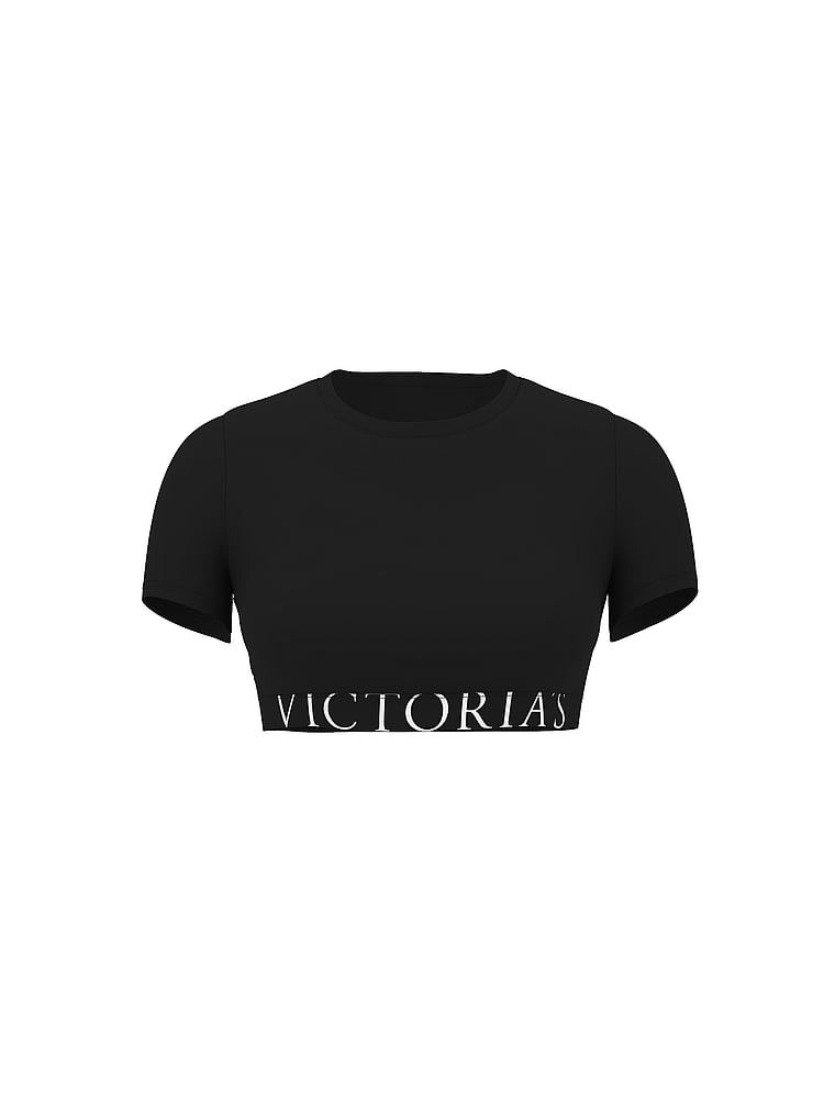 Crop top din bumbac cu mâneci scurte. Produsul este negru și provine din colecția de tricouri.