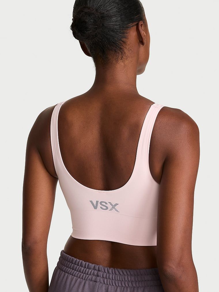 Sutien sport VSX Elevate cu un finisaj neted. Produsul este roz și provine din colecția VSX.