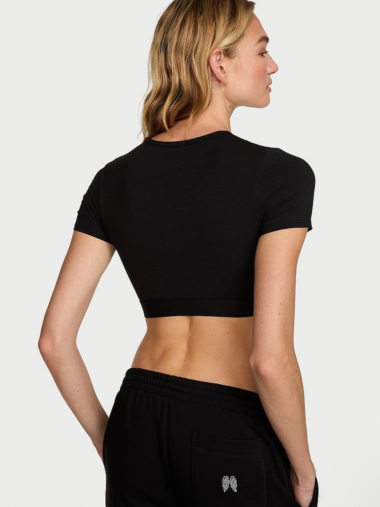 Bralette scurt din bumbac cu mâneci scurte Shine Patch. Produsul este negru și provine din colecția de tricouri.