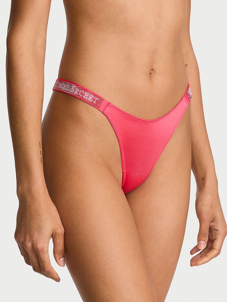 Tanga cu curele lucioase Shine Strap. Produsul este roșu și provine din colecția Very Sexy.