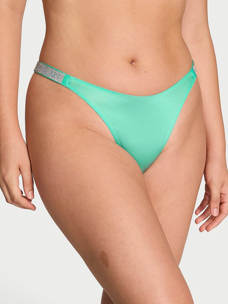 Tanga cu curele lucioase Shine Strap. Produsul este de culoare albastră și provine din colecția Very Sexy.