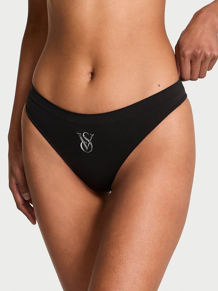 Tanga fără cusături cu logo strălucitor Sparkle. Produsul este negru și provine din colecția Seamless