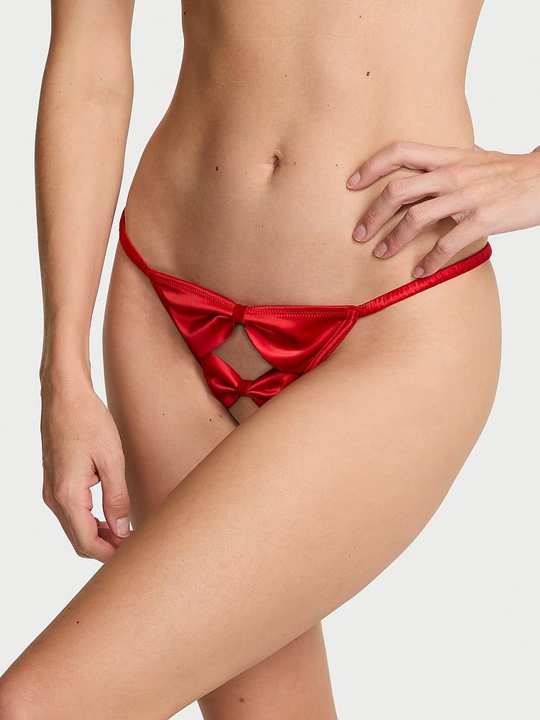 Tanga fără picioare Satin Bow. Produsul este de culoare roșie și provine din colecția Dream Angels.