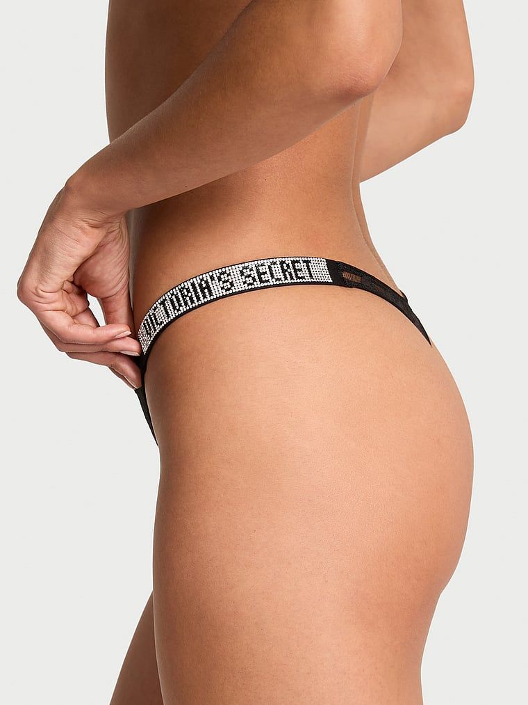 Tanga Shine Strap Rose Lace. Produsul este negru și provine din colecția Very Sexy.