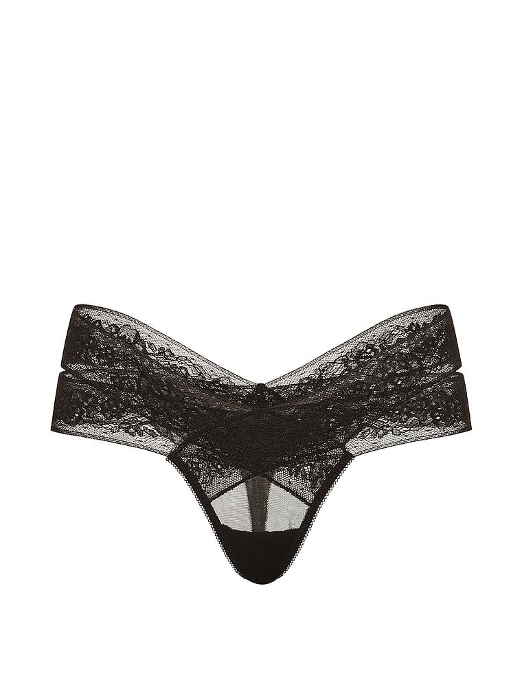 Tanga cu decupaje și dantelă cu bretele. Produsul este negru și provine din colecția Very Sexy.