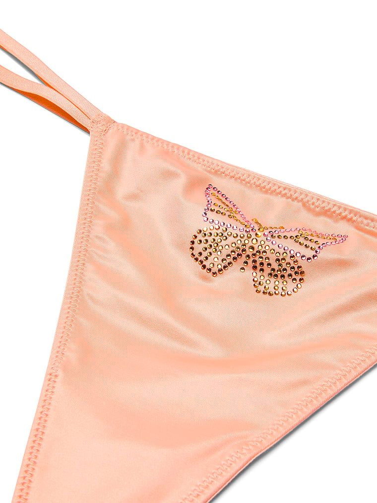 Tanga din satin Twinkle Butterfly. Produsul este de culoare bej și provine din colecția Dream Angels.