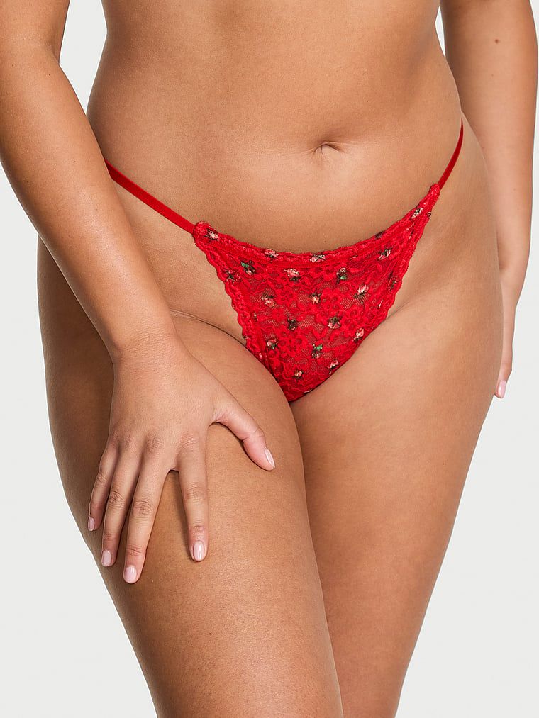 Tanga din dantelă. Produsul este de culoare florală și provine din colecția Lacie.