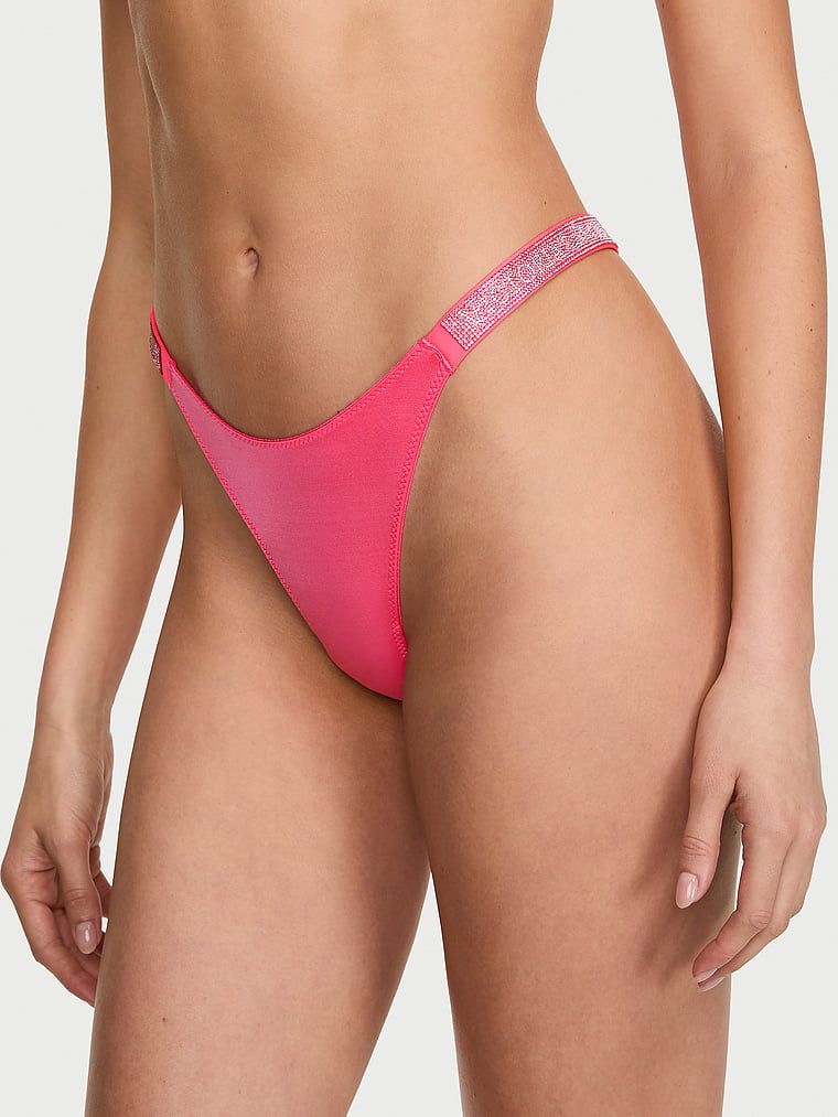 Tanga cu curele lucioase Shine Strap. Produsul este roz și provine din colecția Very Sexy.