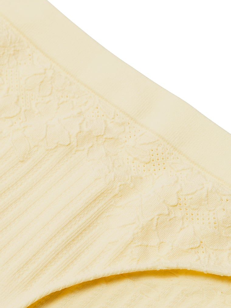 Chiloți de bikini cu pește cu flori. Produsul este de culoare galbenă și provine din colecția Seamless (Seamless Collection).