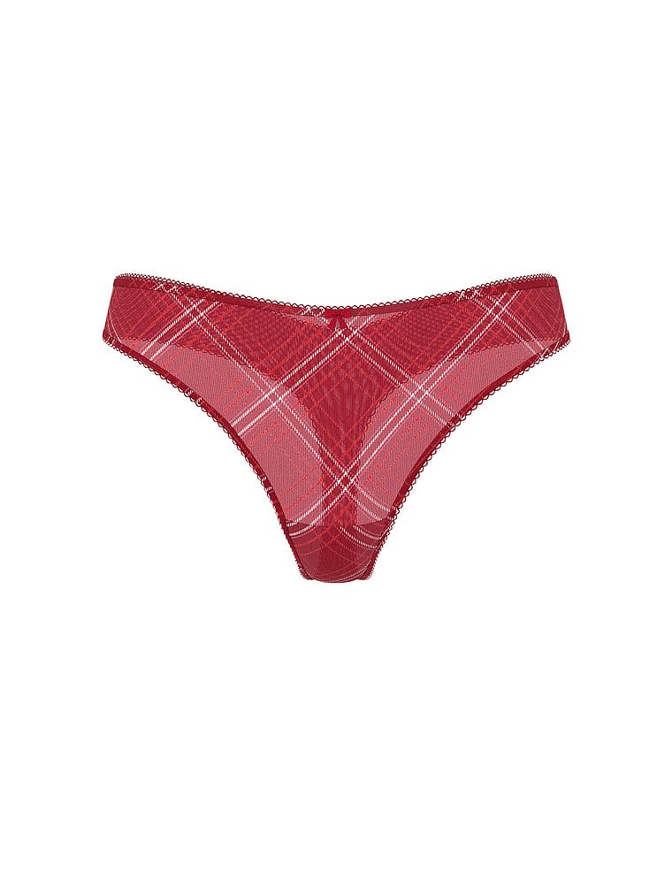 Tanga lucioasă cu plasă strălucitoare. Produsul este modelat și provine din colecția Lacie.