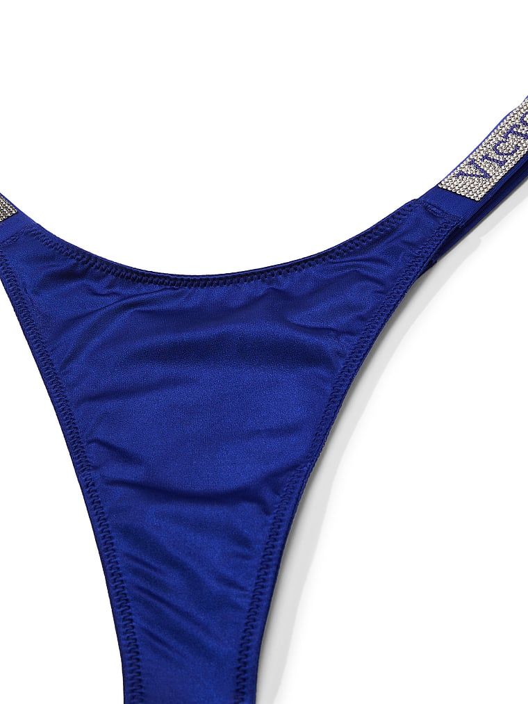 Tanga cu curele lucioase Shine Strap. Produsul este de culoare albastră și provine din colecția Very Sexy.