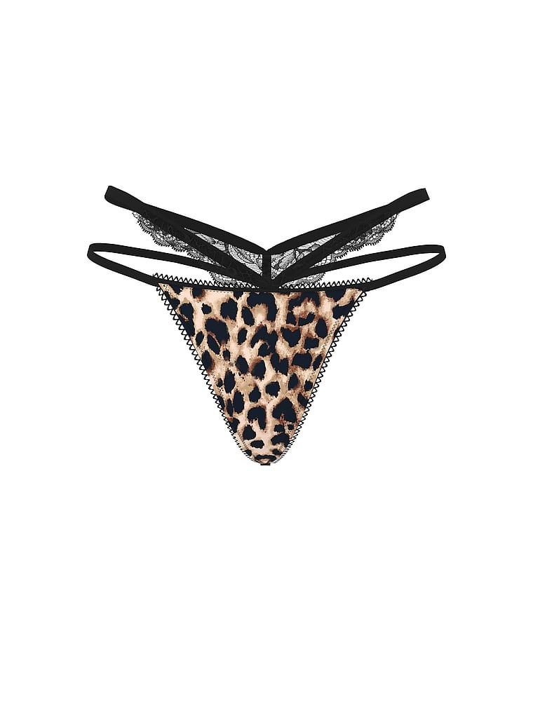 Tanga cu dantelă și decupaje pe laterale. Produsul este modelat și provine din colecția Very Sexy.